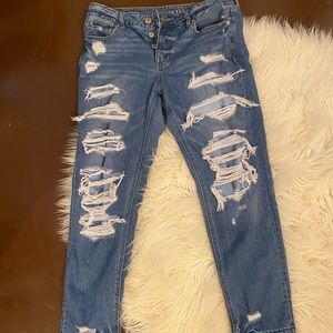 covered ripped American eagle jeans